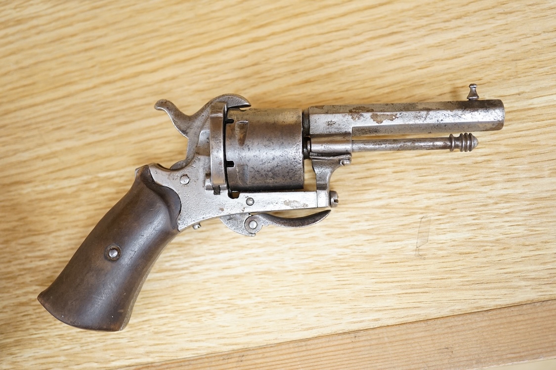 A six shot 7mm Belgian pinfire revolver and another similar, both with folding triggers and wooden grips